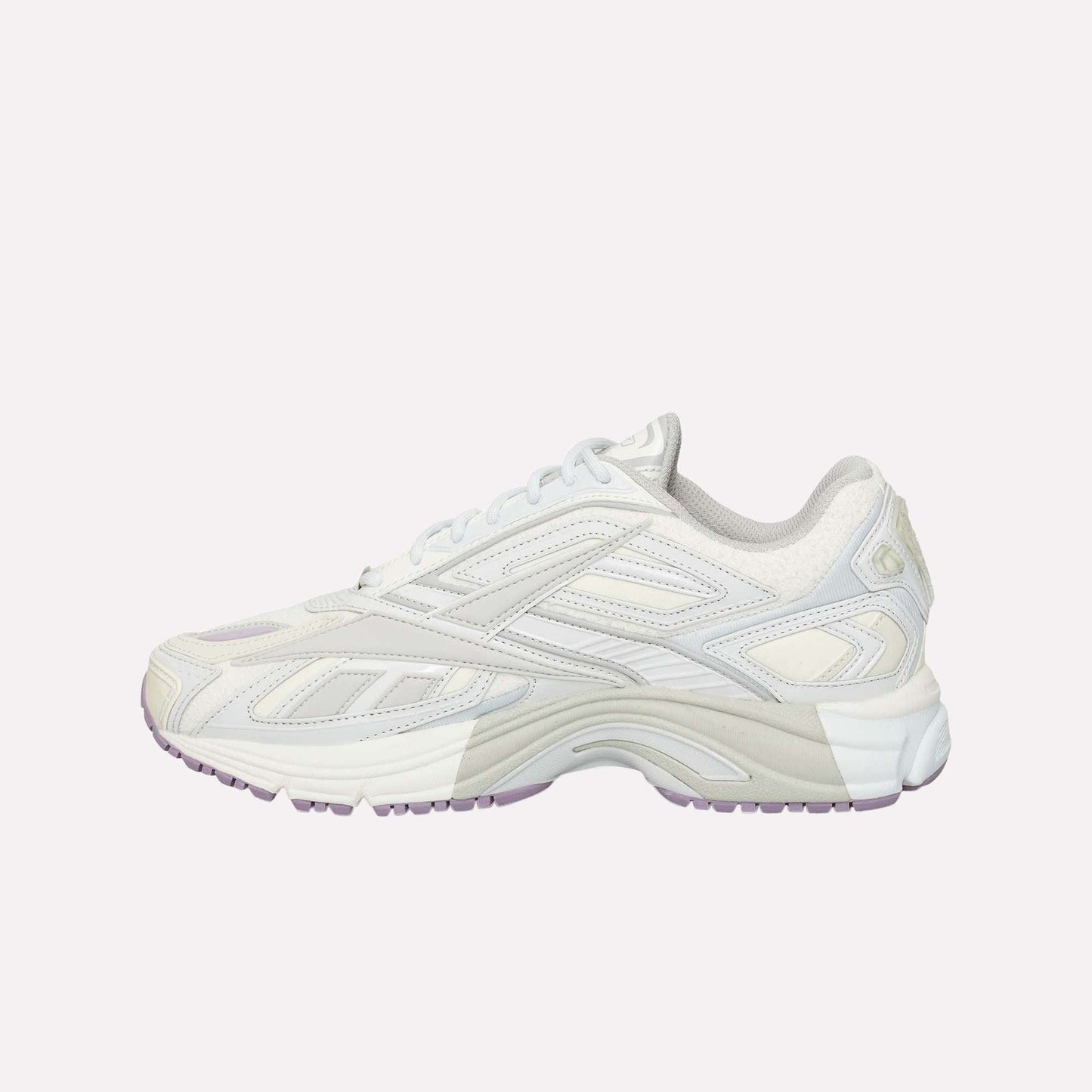 The Reebok Premier Road Ultra running sneaker, shown from the side on a white background, features a white and light gray colorway with purple accents, layered design, dual-density midsole, and textured sole.