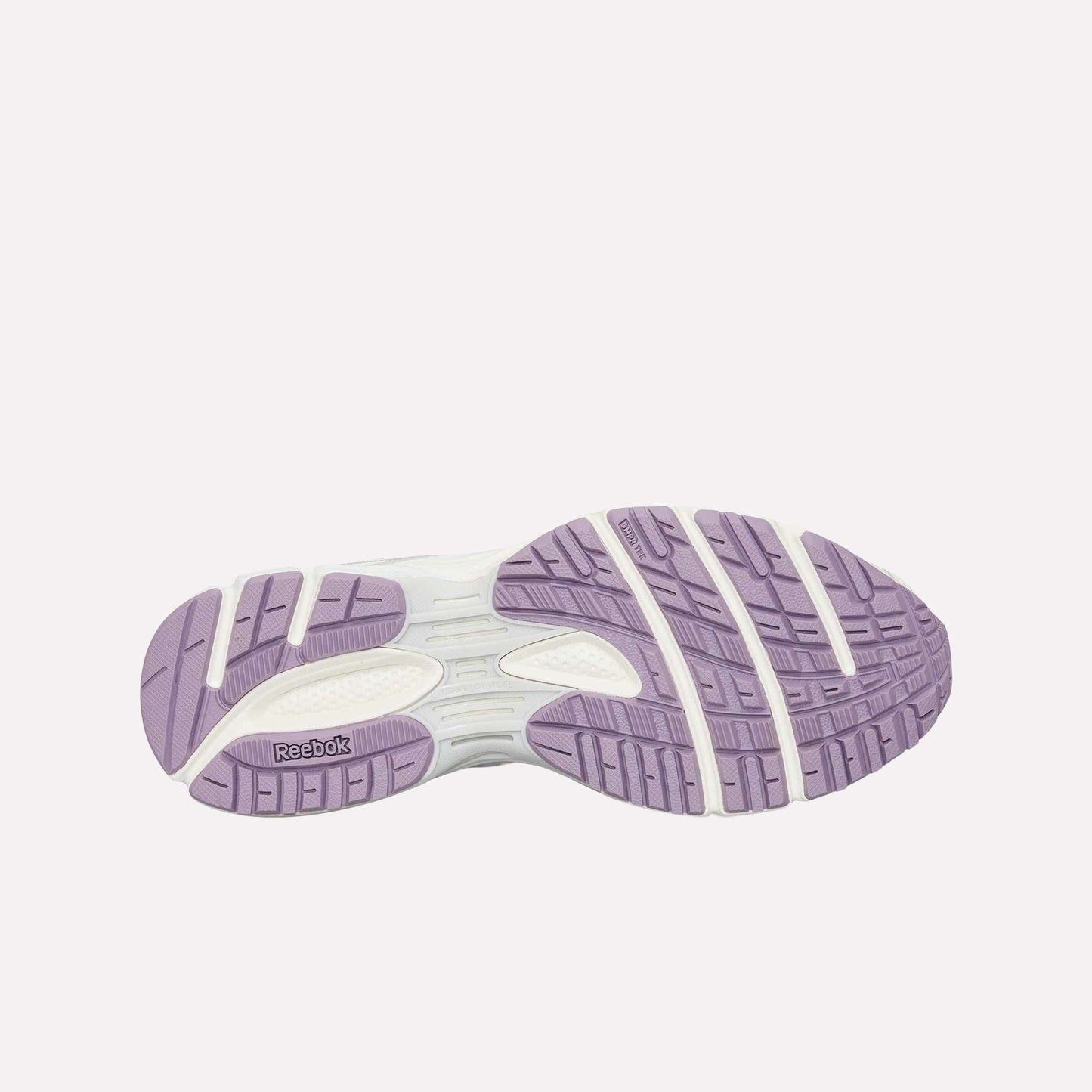 The image displays the sole of the Reebok Premier Road Ultra, featuring light purple and white rubber treads with grooves for traction. The Reebok logo appears on the bottom left.