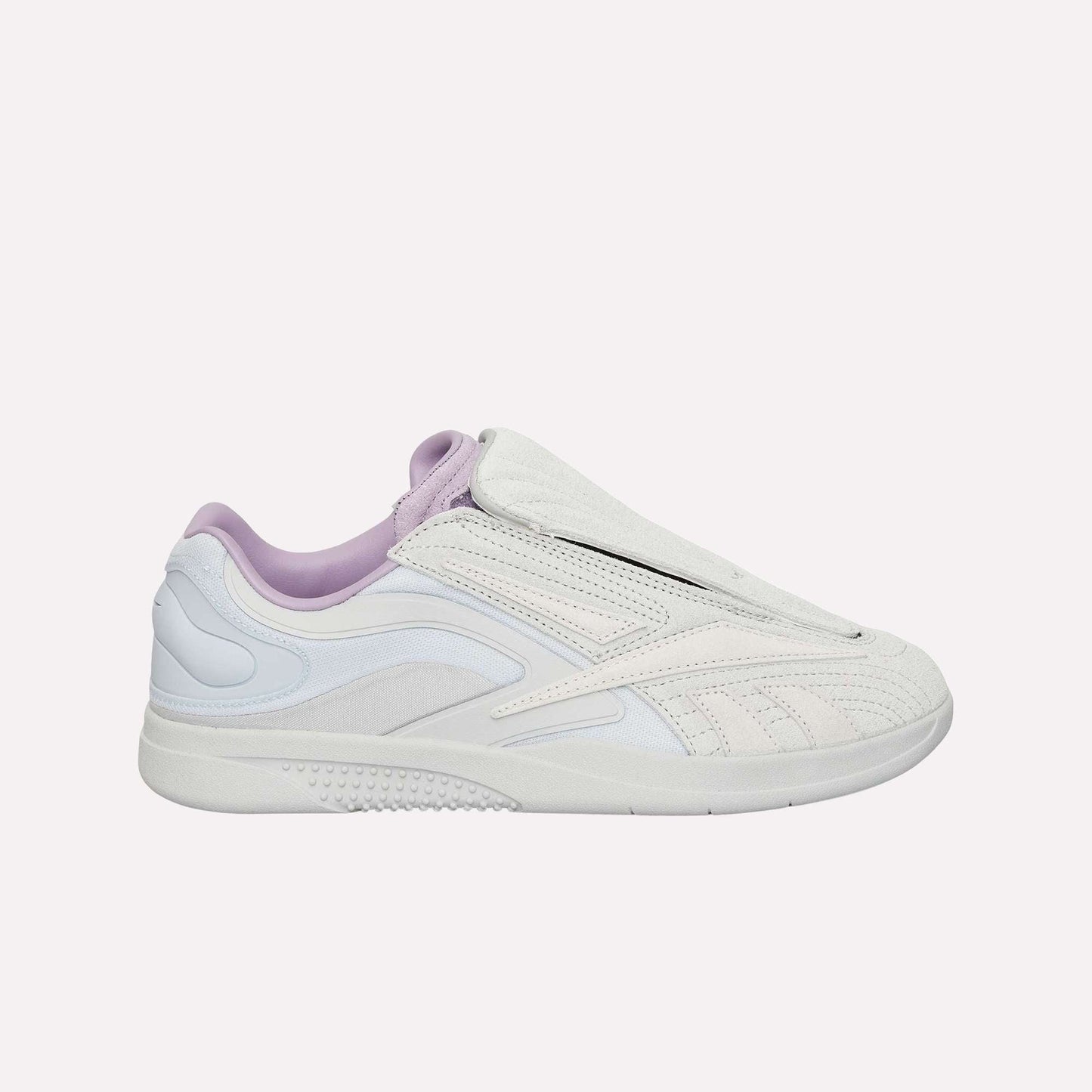 A white and light gray Reebok Hammer Pro Ltd sneaker with a suede upper, lavender lining, sleek design, and subtle textured details, displayed in profile on a plain white background.