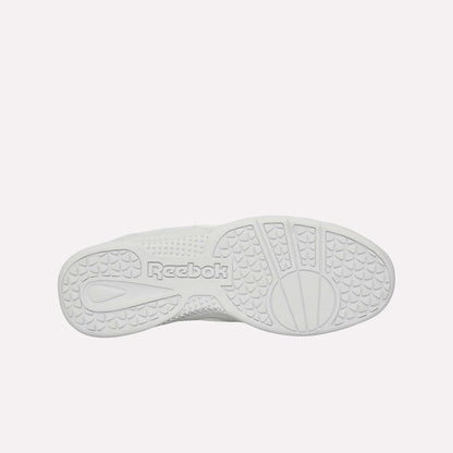 The image displays the bottom sole of the white Reebok Hammer Pro Ltd sneaker, showcasing textured grip patterns and "Reebok" embossed in the center on its sturdy rubber sole.