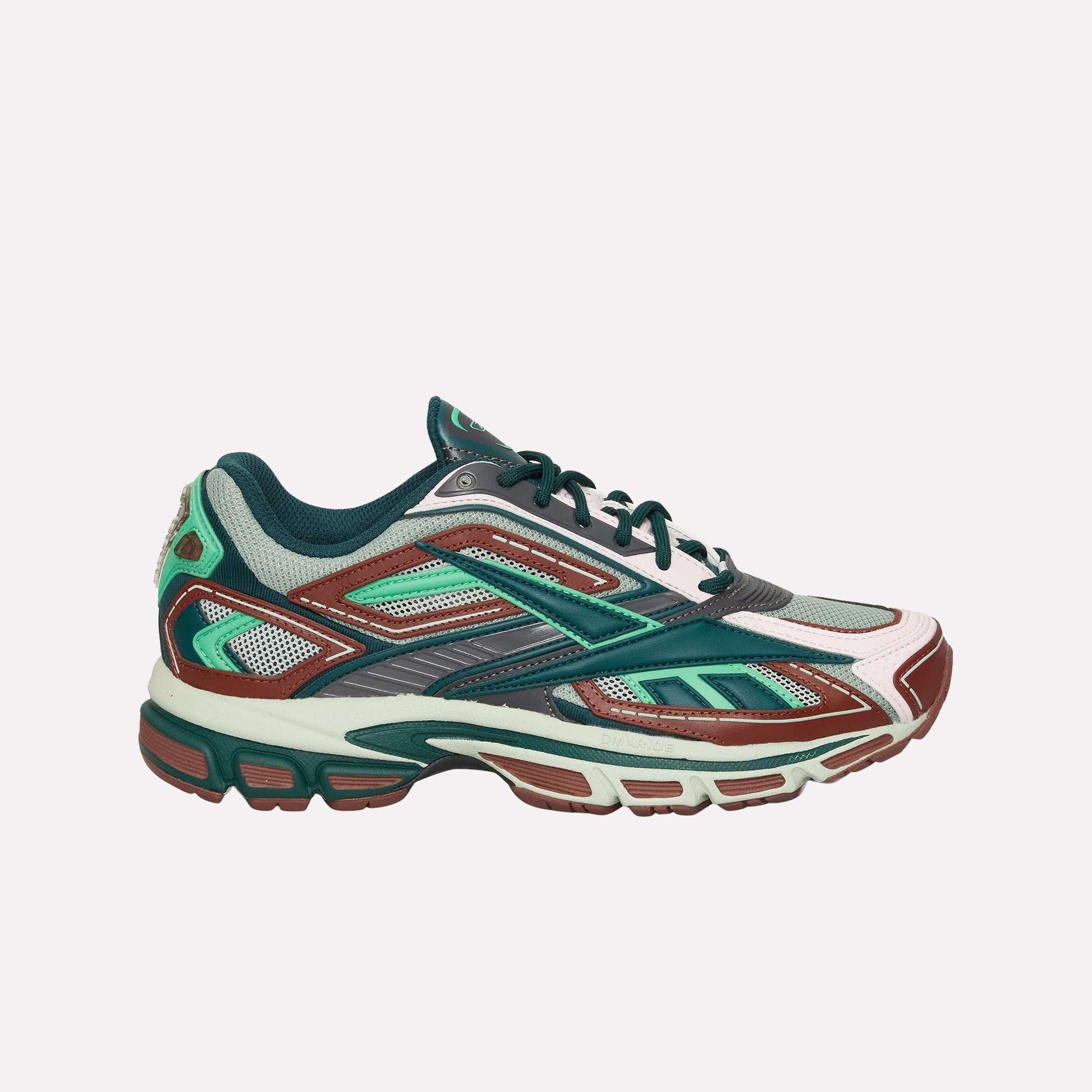 The Reebok Premier Road Ultra is a multicolored running sneaker in green, teal, maroon, white, and gray with a mesh upper, layered synthetic overlays, cushioned sole, and dual-density midsole for enhanced comfort.