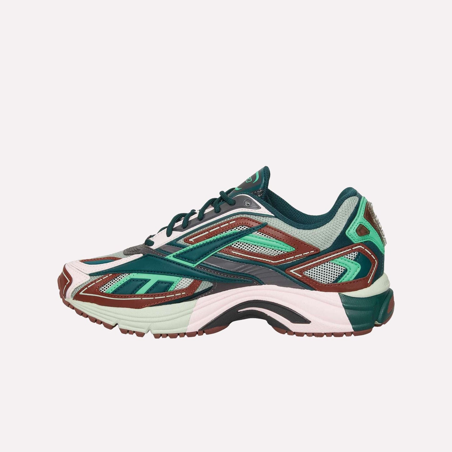 The Reebok Premier Road Ultra is a stylish running sneaker with green, pink, brown, and teal mesh and synthetic panels, a layered look, chunky dual-density midsole, and side profile shown on white. Inspired by the original Premier Road Ultra.