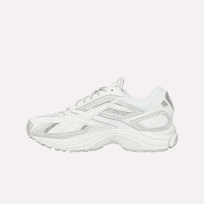 The Reebok Premier Road Ultra is a white athletic sneaker inspired by archival running designs, featuring a mesh and synthetic upper, layered details, dual-density midsole for comfort, and lace-up closure—shown from the side on a plain background.