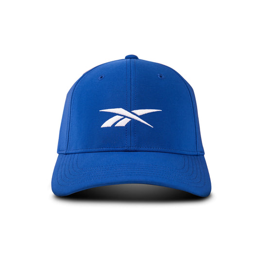 The Reebok Range Cap is a blue baseball hat with a curved brim and a white embroidered logo on the front. Designed for sun protection, it’s shown from the front against a plain white background.